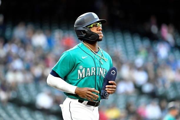 Shed Long Jr. #4 of the Seattle Mariners advances to first base during the game against the Tampa Bay Rays at T-Mobile Park on June 18, 2021 in...