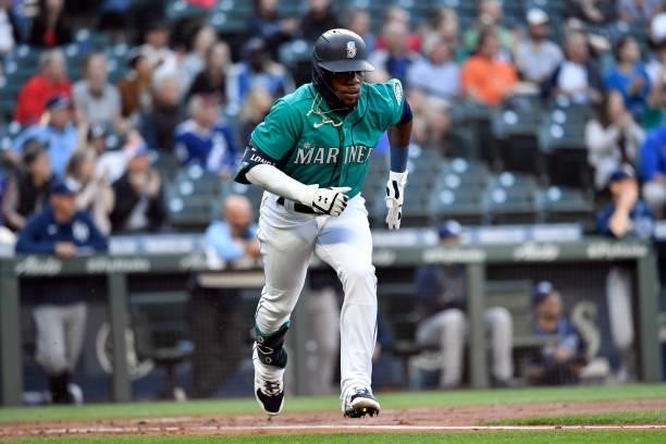 Shed Long Jr. #4 of the Seattle Mariners runs to first base during the game against the Tampa Bay Rays at T-Mobile Park on June 18, 2021 in Seattle,...