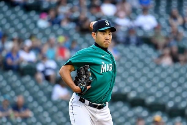 Yusei Kikuchi of the Seattle Mariners checks the first base runner during the game against the Tampa Bay Rays at T-Mobile Park on June 18, 2021 in...