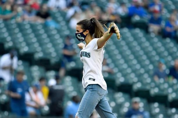 The ceremonial first pitch is thrown by Katie Thurston of ABC's Bachelorette before the game between the Seattle Mariners and the Tampa Bay Rays at...