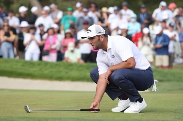 Jon Rahm of Spain lines up a putt on the 18th green during the third round of the 2021 U.S. Open at Torrey Pines Golf Course on June 19, 2021 in San...