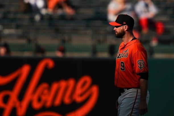 Brandon Belt of the San Francisco Giants warms up prior to the first inning against the Philadelphia Phillies at Oracle Park on June 18, 2021 in San...