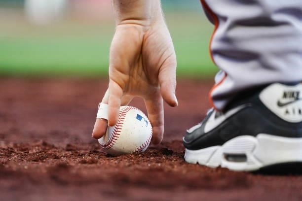 Close up view of an official game ball as it is picked up during the game between the San Francisco Giants and the Philadelphia Phillies at Oracle...