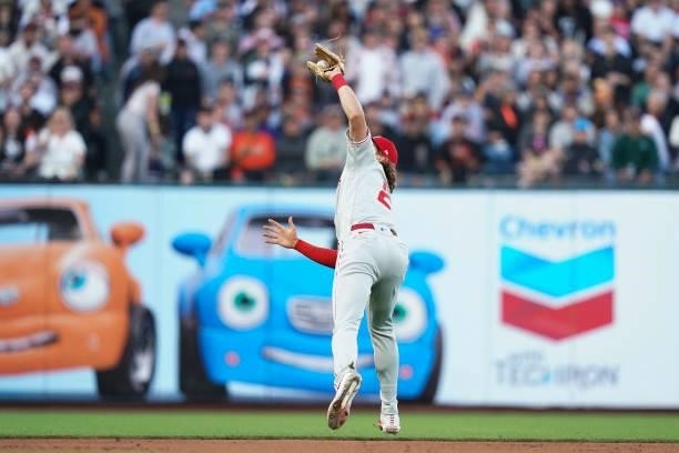 Alec Bohm of the Philadelphia Phillies reaches back to catch a pop fly against the San Francisco Giants at Oracle Park on June 18, 2021 in San...