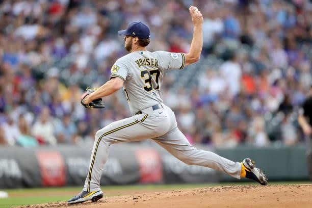 Starting pitcher Adrian Houser of the Milwaukee Brewers throws against the Colorado Rockies in the first inning at Coors Field on June 19, 2021 in...