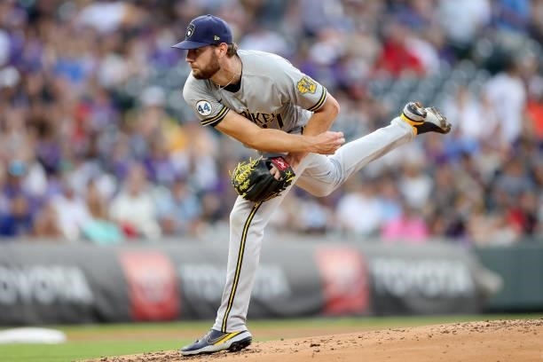 Starting pitcher Adrian Houser of the Milwaukee Brewers throws against the Colorado Rockies in the first inning at Coors Field on June 19, 2021 in...