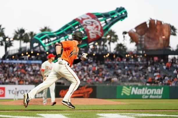 Mike Yastrzemski of the San Francisco Giants runs toward first against the Philadelphia Phillies at Oracle Park on June 18, 2021 in San Francisco,...