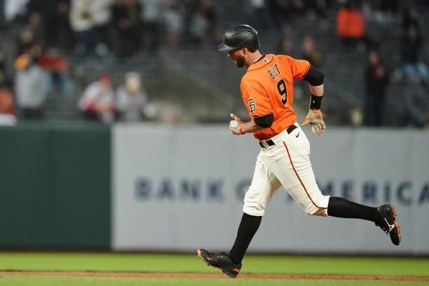 Brandon Belt of the San Francisco Giants rounds the bases against the Philadelphia Phillies at Oracle Park on June 18, 2021 in San Francisco,...