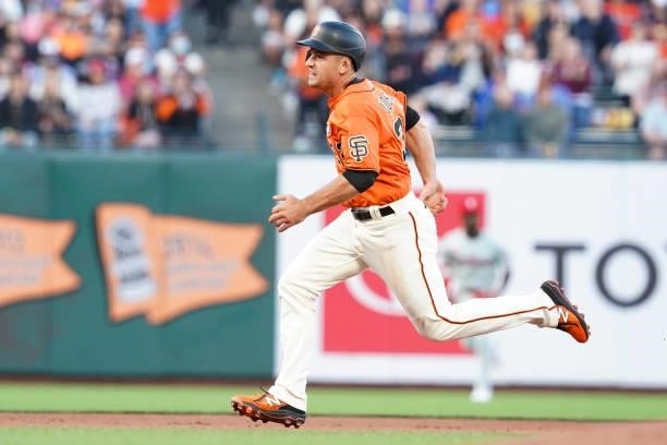Jason Vosler of the San Francisco Giants rounds second base against the Philadelphia Phillies at Oracle Park on June 18, 2021 in San Francisco,...