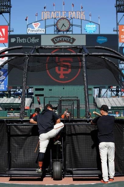 San Francisco Giants players look on during batting practice prior to the game against the Philadelphia Phillies at Oracle Park on June 18, 2021 in...