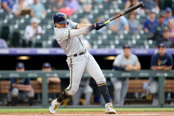 Willy Adames of the Milwaukee Brewers hits a RBI double against the Colorado Rockies in the first inning at Coors Field on June 19, 2021 in Denver,...