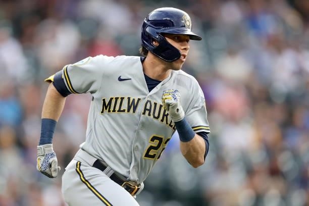Christian Yelich of the Milwaukee Brewers hits a single against the Colorado Rockies in the first inning at Coors Field on June 19, 2021 in Denver,...