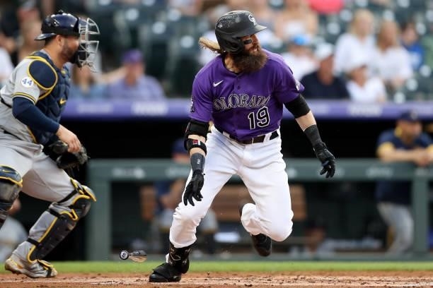 Charlie Blackmon of the Colorado Rockies hits a ground out RBI against the Milwaukee Brewers in the first inning at Coors Field on June 19, 2021 in...