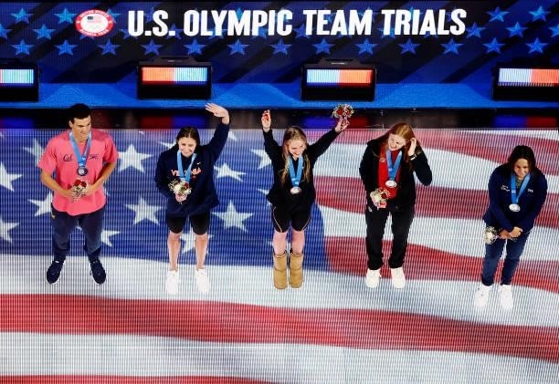 Erica Sullivan, Lydia Jacoby, Calire Curzan, Kate Douglass and Bryce Mefford of the United States react during their medal ceremony during Day Seven...