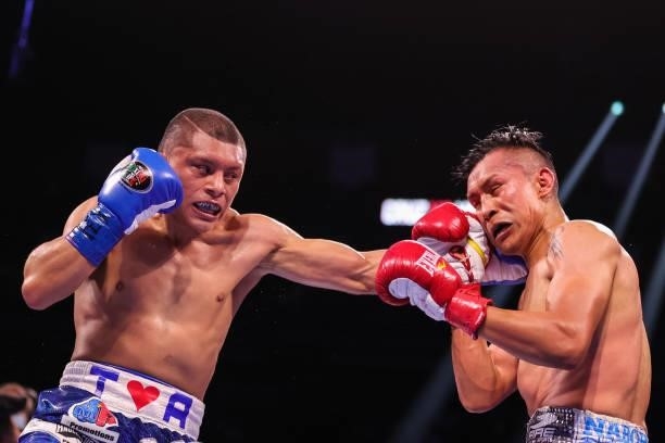 Isaac Cruz exchanges punches with Francisco Vargas during their lightweight bout at Toyota Center on June 19, 2021 in Houston, Texas.