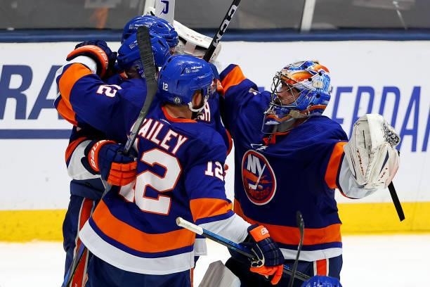 The New York Islanders celebrate their 3-2 win over the Tampa Bay Lightning in Game Four of the Stanley Cup Semifinals during the 2021 Stanley Cup...