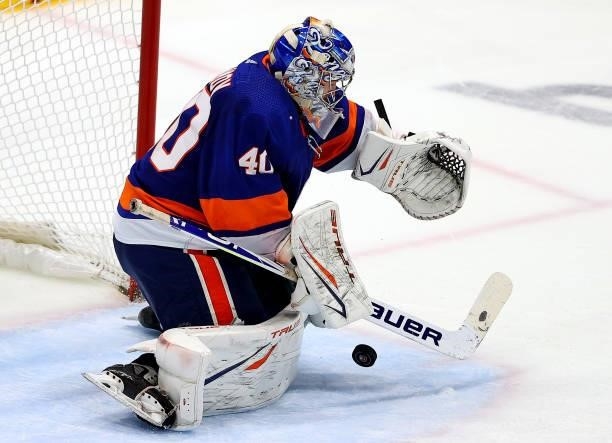 Semyon Varlamov of the New York Islanders makes a safe against the Tampa Bay Lightning during the third period in Game Four of the Stanley Cup...