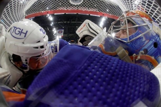 Brayden Point of the Tampa Bay Lightning and Semyon Varlamov of the New York Islanders collide in the net in Game Four of the Stanley Cup Semifinals...