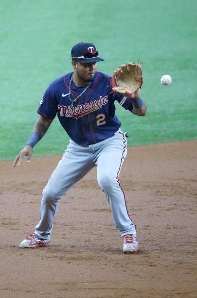 Luis Arraez of the Minnesota Twins fields a ball off the bat of Eli White of the Texas Rangers at Globe Life Field on June 19, 2021 in Arlington,...