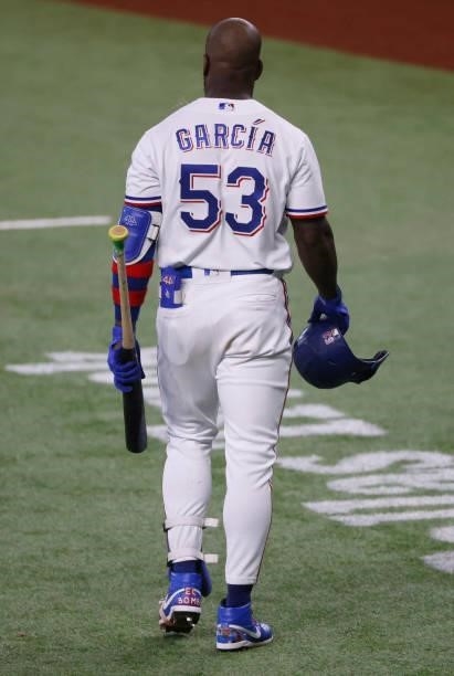 Adolis Garcia of the Texas Rangers walks away after a called strike three against the Minnesota Twins during the eighth inning at Globe Life Field on...