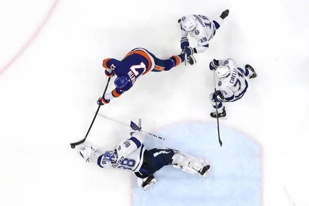 Andrei Vasilevskiy of the Tampa Bay Lightning defends against Matt Martin of the New York Islanders in Game Four of the Stanley Cup Semifinals during...