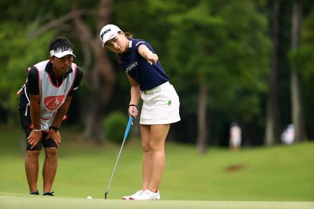 Risa Murata of Japan discusses with her caddie on the 5th green during the final round of Nichirei Ladies at Sodegaura Country Club Shinsode Course...