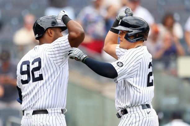 Gio Urshela and Chris Gittens of the New York Yankees in action against the Oakland Athletics during a game at Yankee Stadium on June 19, 2021 in New...