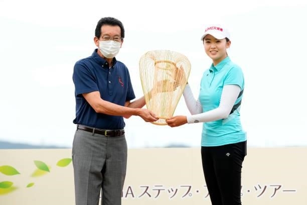 Simin Feng of China receives the trophy after winning the tournament at the award ceremony following the final round of the Yupiteru Shizuoka Shimbun...