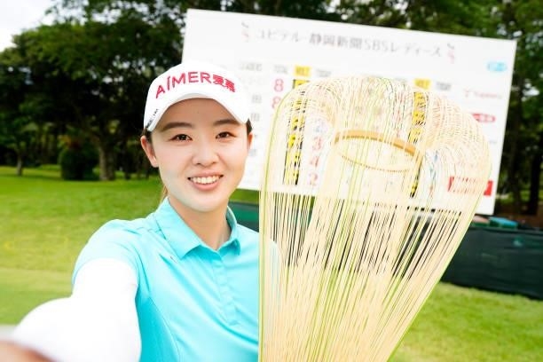Simin Feng of China imitates the selfie after winning the tournament following the final round of the Yupiteru Shizuoka Shimbun SBS Ladies at the...