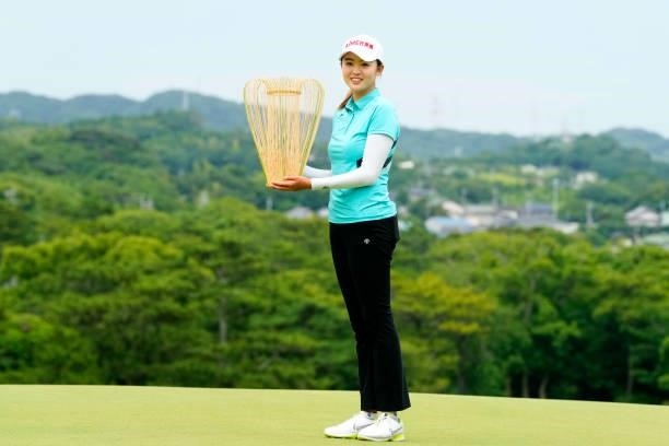 Simin Feng of China poses with the trophy after winning the tournament following the final round of the Yupiteru Shizuoka Shimbun SBS Ladies at the...