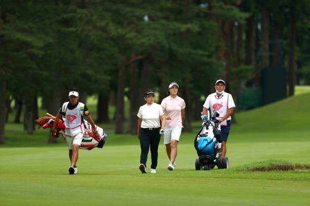 Jiyai Shin and Mi-jeong Jeon of South Korea walk on the 18th fairway at the playoff second hole during the final round of Nichirei Ladies at...