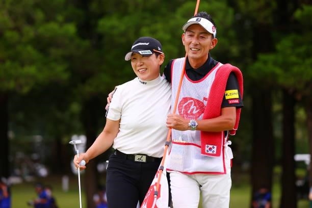 Jiyai Shin of South Korea celebrates winning the tournament through the playoff with her caddie on the 18th green during the final round of Nichirei...