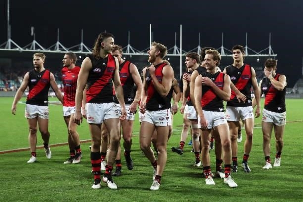 Sam Draper and Dyson Heppell celebrate victory with team mates after the round 14 AFL match between the Hawthorn Hawks and the Essendon Bombers at...