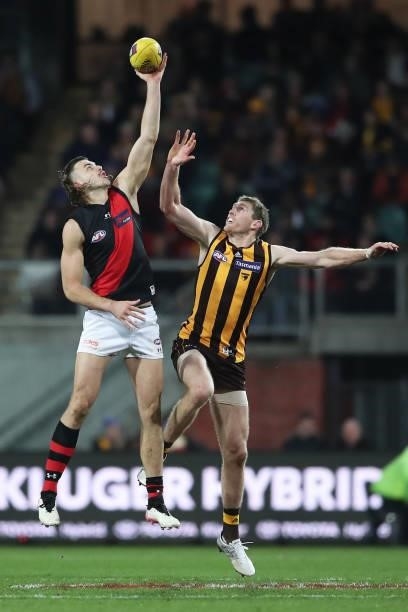 Sam Draper of the Bombers and Ben McEvoy of the Hawks contest the ball during the round 14 AFL match between the Hawthorn Hawks and the Essendon...