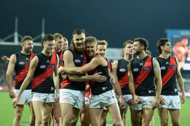 Dyson Heppell and Sam Draper of the Bombers celebrate the win during the round 14 AFL match between the Hawthorn Hawks and the Essendon Bombers at...