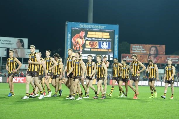 Hawks leave the field after the game during the round 14 AFL match between the Hawthorn Hawks and the Essendon Bombers at University of Tasmania...