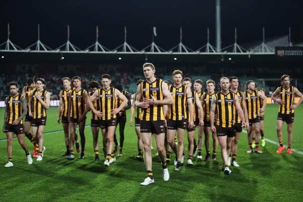 Ben McEvoy of the Hawks and team mates look dejected after the round 14 AFL match between the Hawthorn Hawks and the Essendon Bombers at University...