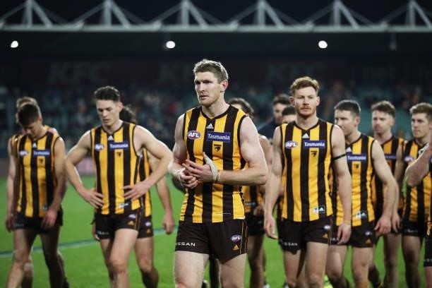 Ben McEvoy of the Hawks and team mates look dejected after the round 14 AFL match between the Hawthorn Hawks and the Essendon Bombers at University...