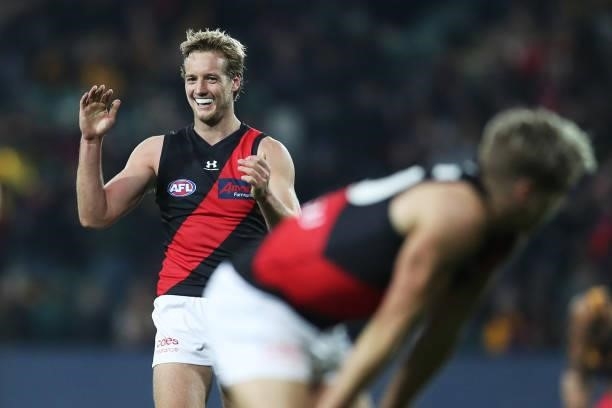 Darcy Parish of the Bombers celebrates victory with team mates after the round 14 AFL match between the Hawthorn Hawks and the Essendon Bombers at...