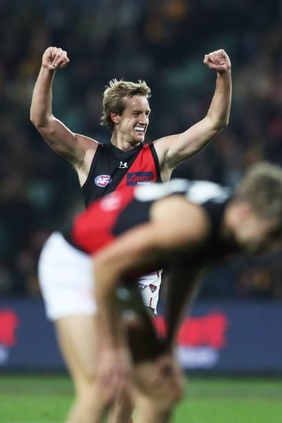 Darcy Parish of the Bombers celebrates victory with team mates after the round 14 AFL match between the Hawthorn Hawks and the Essendon Bombers at...