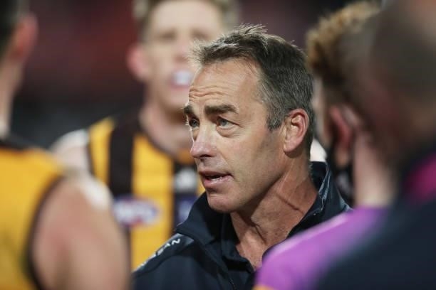 Hawks head coach Alastair Clarkson speaks to players at three quarter time during the round 14 AFL match between the Hawthorn Hawks and the Essendon...