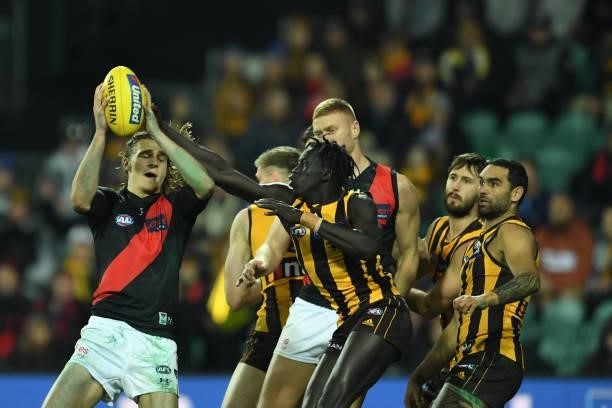 Harrison Jones of the Bombers takes a mark during the round 14 AFL match between the Hawthorn Hawks and the Essendon Bombers at University of...