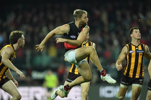 Jake Stringer of the Bombers kicks a goal during the round 14 AFL match between the Hawthorn Hawks and the Essendon Bombers at University of Tasmania...