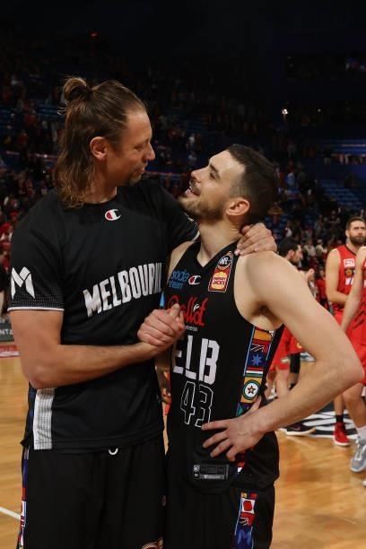 David Anderson and Chris Goulding of Melbourne United share a moment after winning game two of the NBL Grand Final Series between the Perth Wildcats...