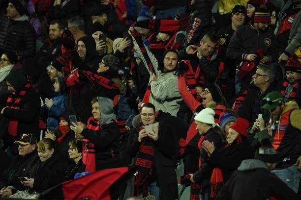 Essendon fans celebrate during the round 14 AFL match between the Hawthorn Hawks and the Essendon Bombers at University of Tasmania Stadium on June...