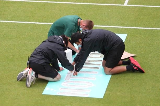 Ground staff prepare the court during day 8 of the Nottingham Trophy at Nottingham Tennis Centre on June 20, 2021 in Nottingham, England.