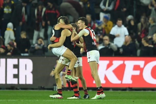 Essendon players celebrate the win during the round 14 AFL match between the Hawthorn Hawks and the Essendon Bombers at University of Tasmania...