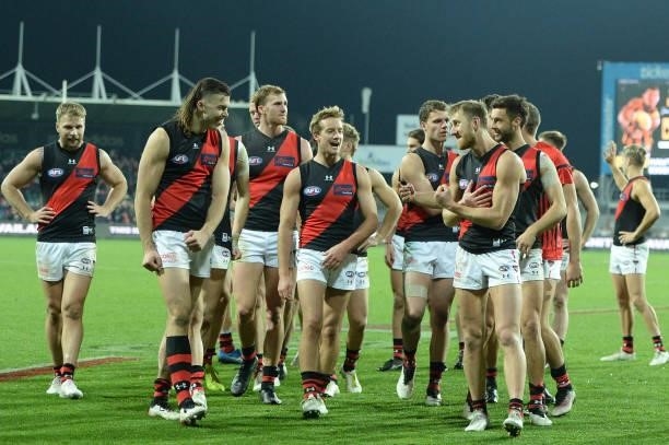 Dyson Heppell of the Bombers leads the team from the field during the round 14 AFL match between the Hawthorn Hawks and the Essendon Bombers at...