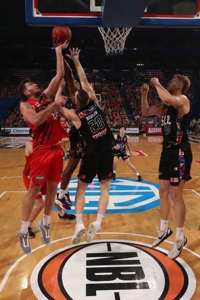 Will Magnay of the Wildcats contests for a rebound against Scotty Hopson and David Barlow of Melbourne United during game two of the NBL Grand Final...