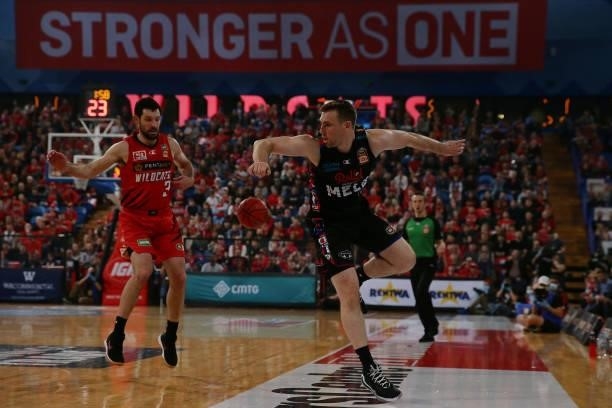 Mitch McCarron of Melbourne United tries to keep the ball in play during game two of the NBL Grand Final Series between the Perth Wildcats and...